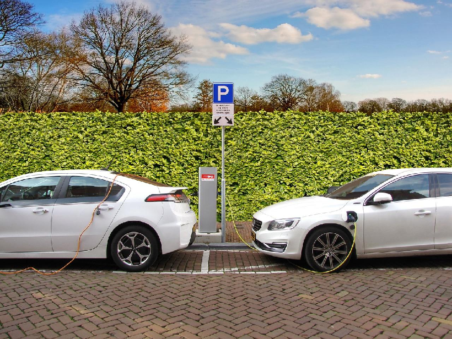 Vehicles fueling at a public EV charging station